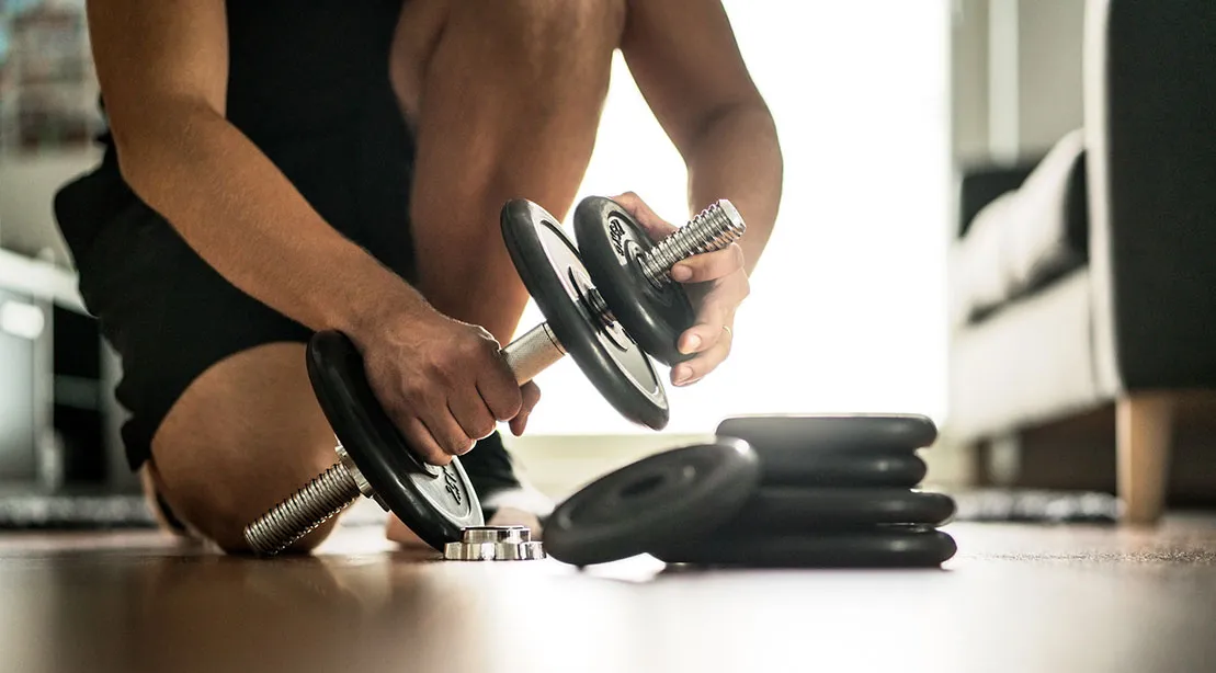 Strengthening back and arms with dumbbell rows